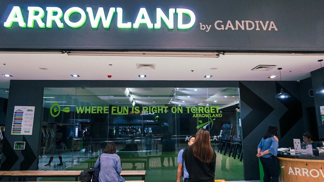 Arrowland by Gandiva storefront at SM Megamall with neon green signage and Where Fun Is Right On Target tagline